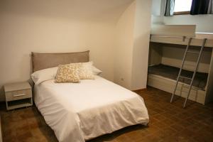 Postel nebo postele na pokoji v ubytování Al Bodregon - Relax e tradizione nel borgo di Bagnone