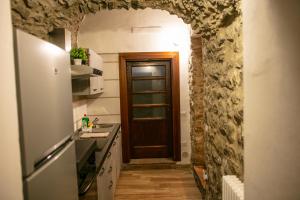 Kuchyň nebo kuchyňský kout v ubytování Al Bodregon - Relax e tradizione nel borgo di Bagnone
