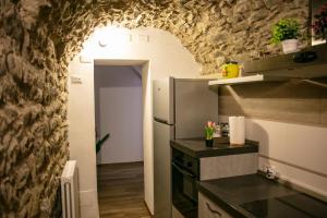 Kuchyň nebo kuchyňský kout v ubytování Al Bodregon - Relax e tradizione nel borgo di Bagnone