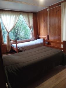 Voodi või voodid majutusasutuse HOSTEL Casa de campo Niña bosque toas