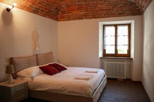 Postel nebo postele na pokoji v ubytování Al Bodregon - Relax e tradizione nel borgo di Bagnone