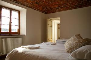 Postel nebo postele na pokoji v ubytování Al Bodregon - Relax e tradizione nel borgo di Bagnone