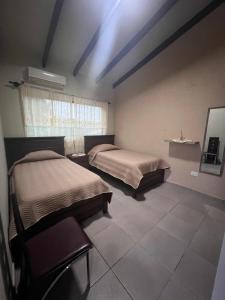 En eller flere senge i et værelse på Casa bonita y cómoda
