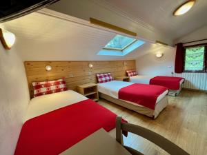 Säng eller sängar i ett rum på Chalet Le Panoramique