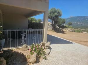 a house with a gate and flowers in front of it at Appartement Caroline in Sotta