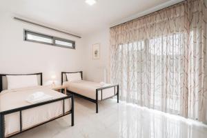 Posteľ alebo postele v izbe v ubytovaní Zante Luxury Apartment