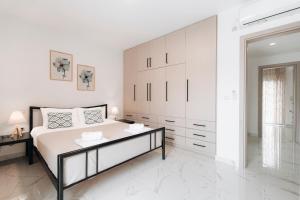 Posteľ alebo postele v izbe v ubytovaní Zante Luxury Apartment