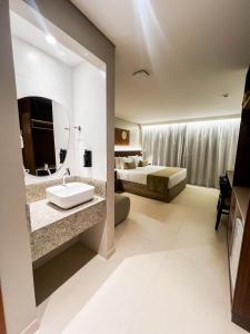 Postel nebo postele na pokoji v ubytování Smart Hotel João Pessoa