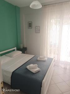 Postel nebo postele na pokoji v ubytování Apartment R&F1