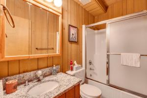 a bathroom with a toilet and a sink and a shower at Half Mile to Ski Slopes Conway Condo with Hot Tub! in North Conway +29 photos