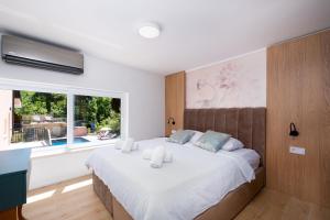 Postel nebo postele na pokoji v ubytování Villa Providenca Annex + 37 fotografií