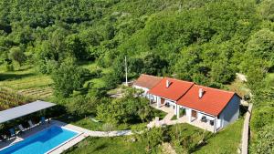 an aerial view of a house with a red roof at Rustic Village House 4 in Rijeka Crnojevića