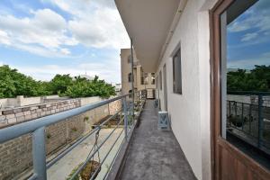 a balcony with a view of a building at Sirik in Yerevan