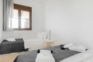 Кровать или кровати в номере Pine in the sea Nikiti-Sithonia