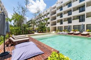 Bazén v ubytování Xibalba 423 Estudio ideal para ti/Gym/Piscina/Tina BY SANDY PAWERFUL nebo v jeho okolí