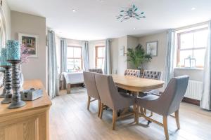 a dining room with a wooden table and chairs at Glenvela guest house in Castlerea