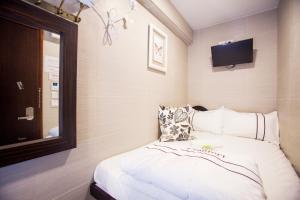 Katil atau katil-katil dalam bilik di Joyous Guest House