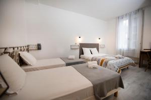 Postel nebo postele na pokoji v ubytování Hotel 1610