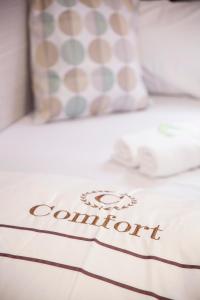 Katil atau katil-katil dalam bilik di Joyous Guest House