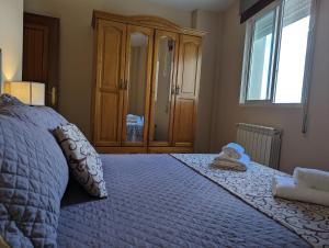 Łóżko lub łóżka w pokoju w obiekcie Noly Apartamento