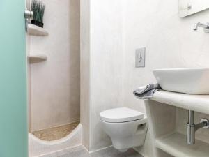 a bathroom with a toilet and a sink and a shower at Premium Naxos Suite Family Suite With Private Balcony Modern Furnishing in Naxos Chora