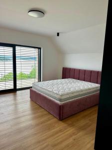 Ένα ή περισσότερα κρεβάτια σε δωμάτιο στο Vila Valkov