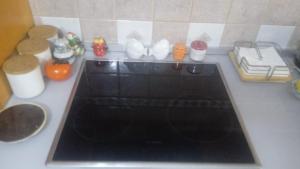 a kitchen counter with a stove top in a kitchen at Conti House in Salerno
