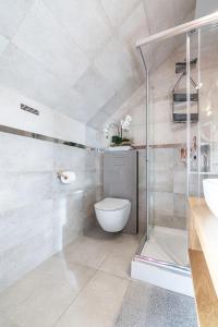 Kúpeľňa v ubytovaní Apartamenty widokowe U Homera