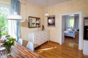 a living room with a table and a dining room at Riverview Residence - with parking in Ljubljana