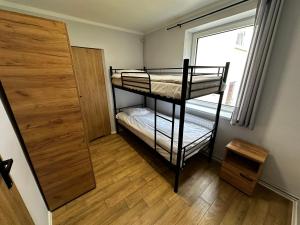 Postel nebo postele na pokoji v ubytování Dom Gościnny u Pierwienieckich