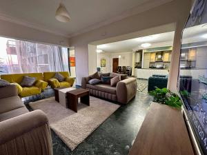 a large living room with couches and a table at شقه مطله علي ممشي أهل مصر علي النيل مباشره in Cairo