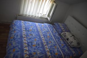 Postel nebo postele na pokoji v ubytování Apartman Nina