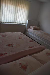 Postel nebo postele na pokoji v ubytování Apartman Nina