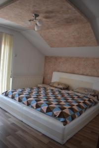 Postel nebo postele na pokoji v ubytování Apartman Nina