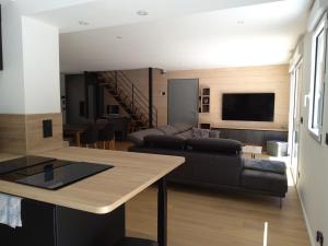 a living room with a couch and a table at Villa STEVAN in Bonifacio