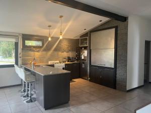 a kitchen with a sink and a counter top at De los rios casa con pileta in San Carlos de Bariloche