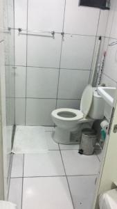 a bathroom with a toilet and a sink at Boa Vista in Recife