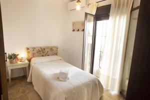 Ένα ή περισσότερα κρεβάτια σε δωμάτιο στο LA POSADA DE LA MUELA