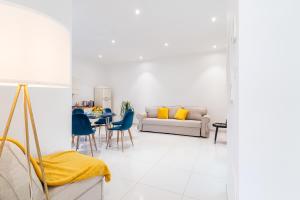 a living room with a couch and a table at Villa Talia in Sorrento