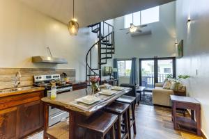 a kitchen with a table and some chairs in a room at Louis' Apartments in Placencia