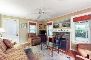 a living room with a couch and a fireplace at Town of Rehoboth Beach --- 206 Norfolk St in Rehoboth Beach