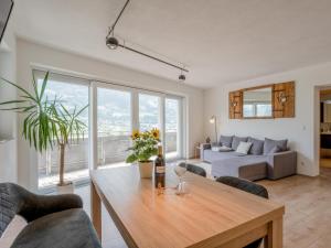 a living room with a table and a couch at Konrad in Hart im Zillertal