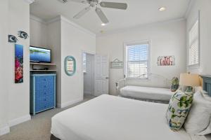 a bedroom with a bed and a flat screen tv at Southern Nights At Destin Pointe Resort in Destin +32 photos