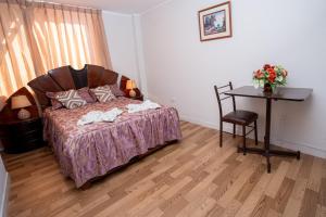 Postel nebo postele na pokoji v ubytování Hotel Residencial C´BASTIAN