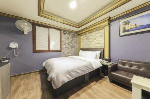 Кровать или кровати в номере Nobless Motel