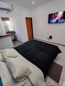 Säng eller sängar i ett rum på España Stay