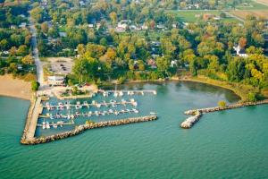 an aerial view of a dock in a lake at Dreamcatcher Coast House in Essex