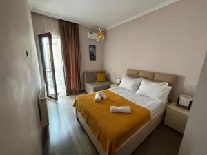 Postel nebo postele na pokoji v ubytování Borjomi inn