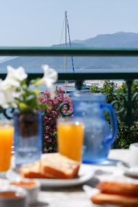 a table with sandwiches and glasses of orange juice at Galaxy Rooms in Paralion astros