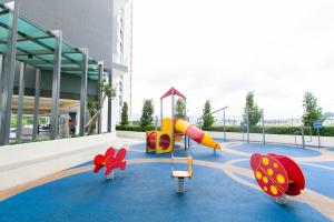 a playground in front of a building with a slide at [Projector] Pulse Ipoh- Safari @Majestic condo in Ipoh